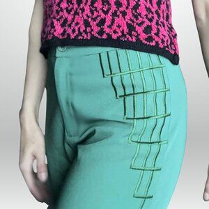 Wide leg green dress pants with detailing on the sides